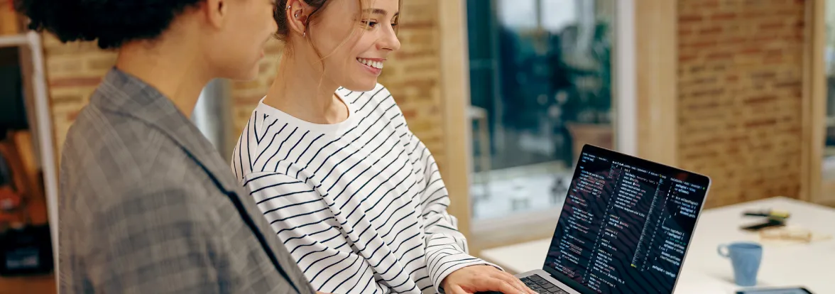 Two software gig workers chat over a laptop